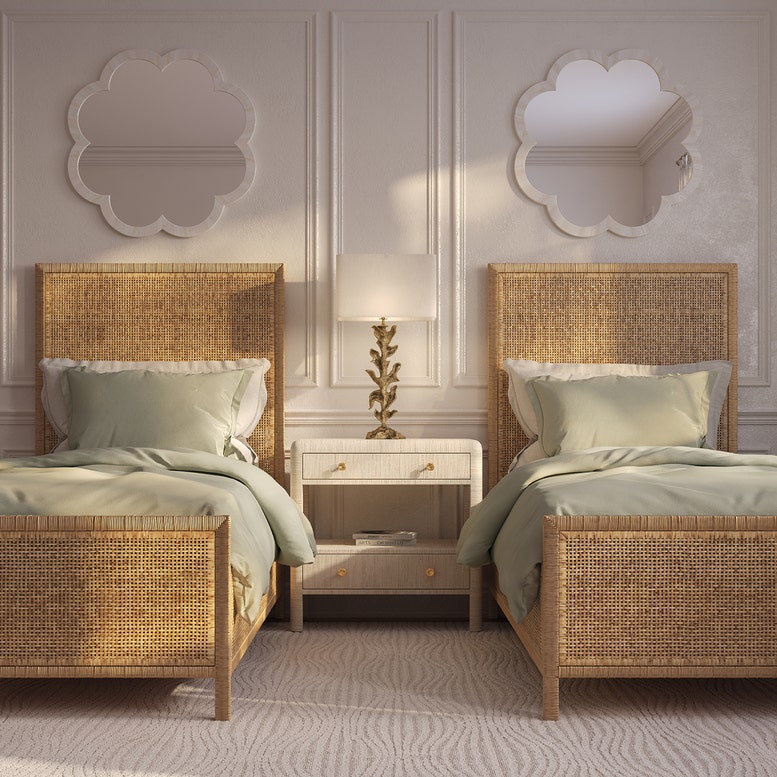 Two wicker beds with matching headboards in a bedroom setting.