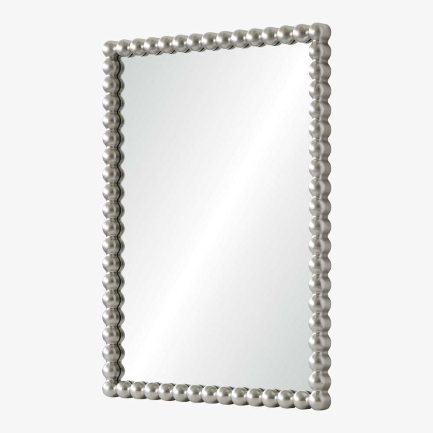Rectangular mirror with decorative pearl-like frame on a white background
