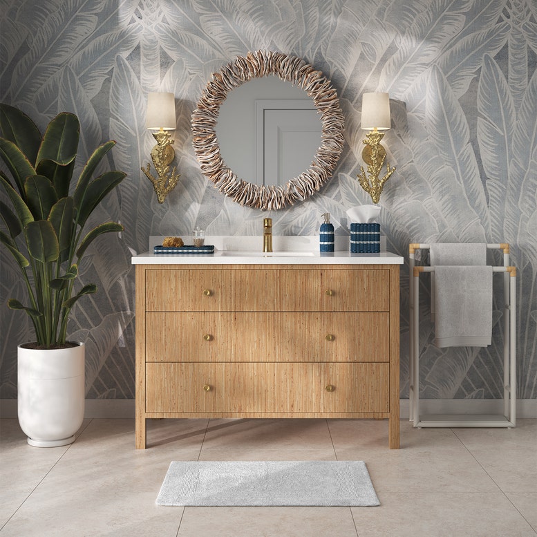 Bathroom with wooden vanity, round mirror, and decorative elements.