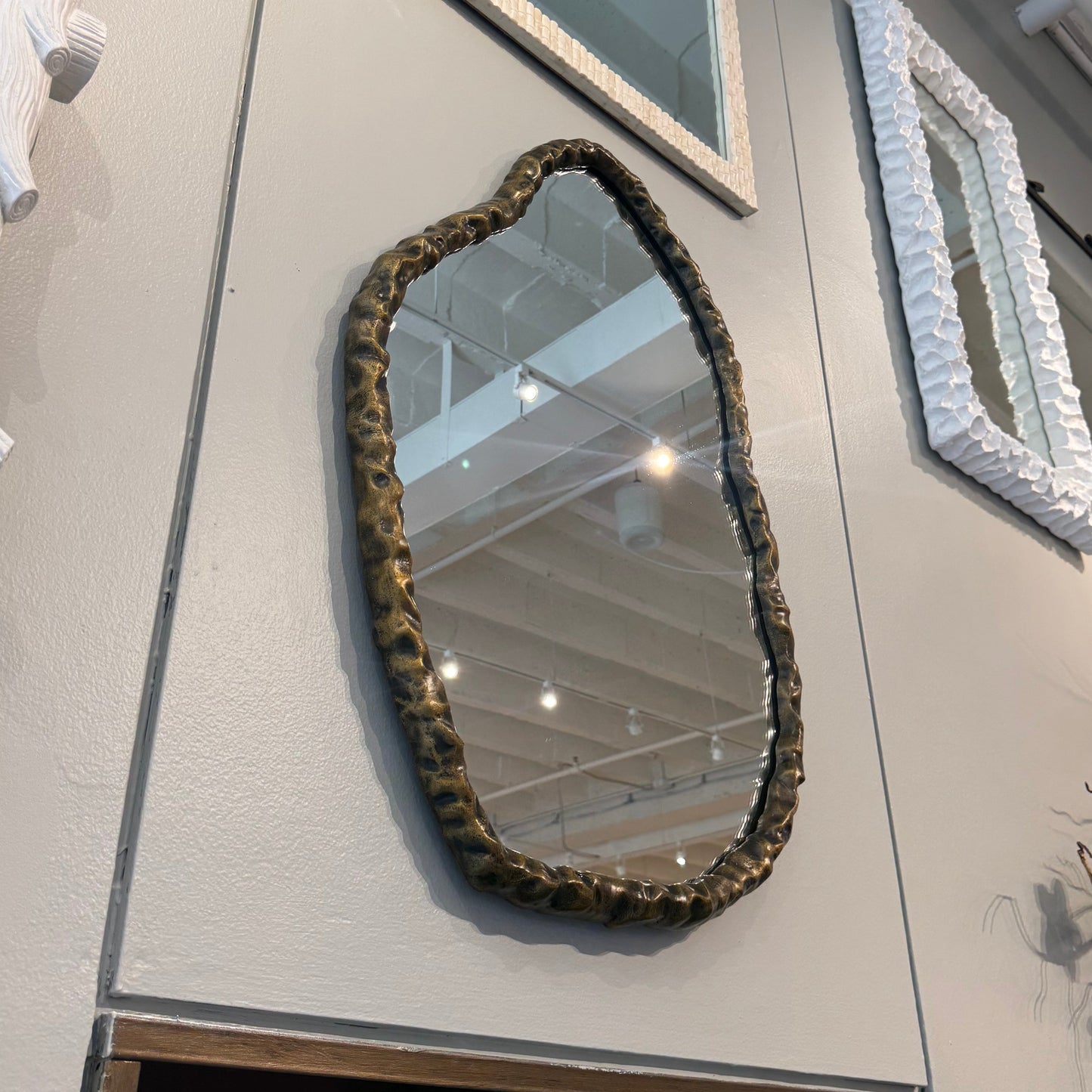 Collection of decorative mirrors on a light gray surface