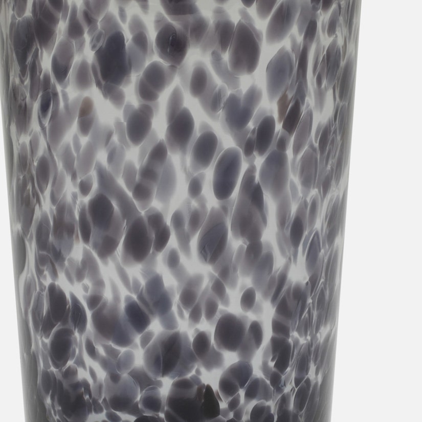 Glass tumbler with a textured black and white pattern on a white background