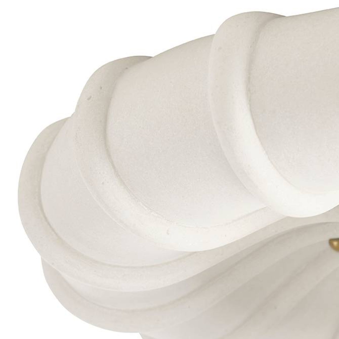 Close-up of a white marble sculpture with a gold accent on a white background