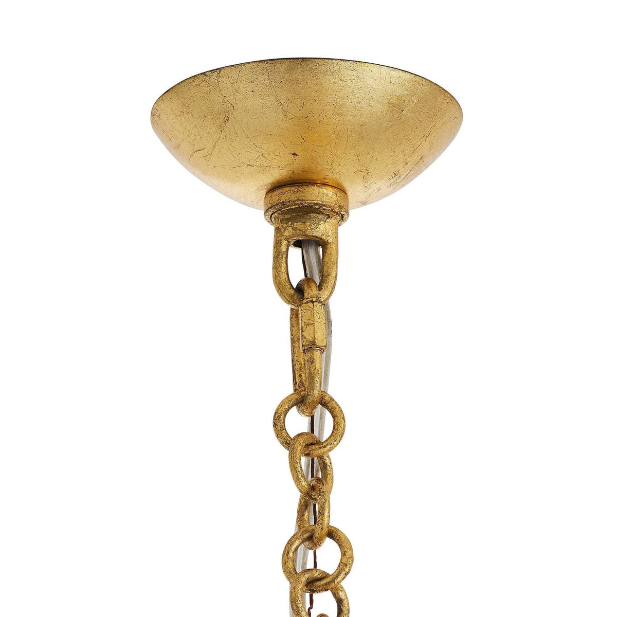 Gold pendant light fixture with chain on a white background