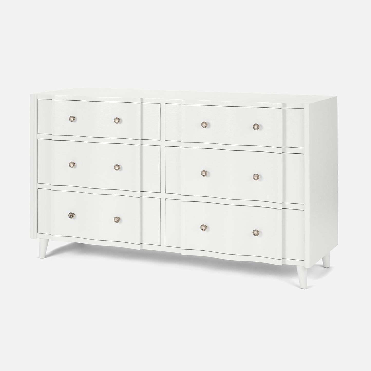 White dresser with multiple drawers on a white background