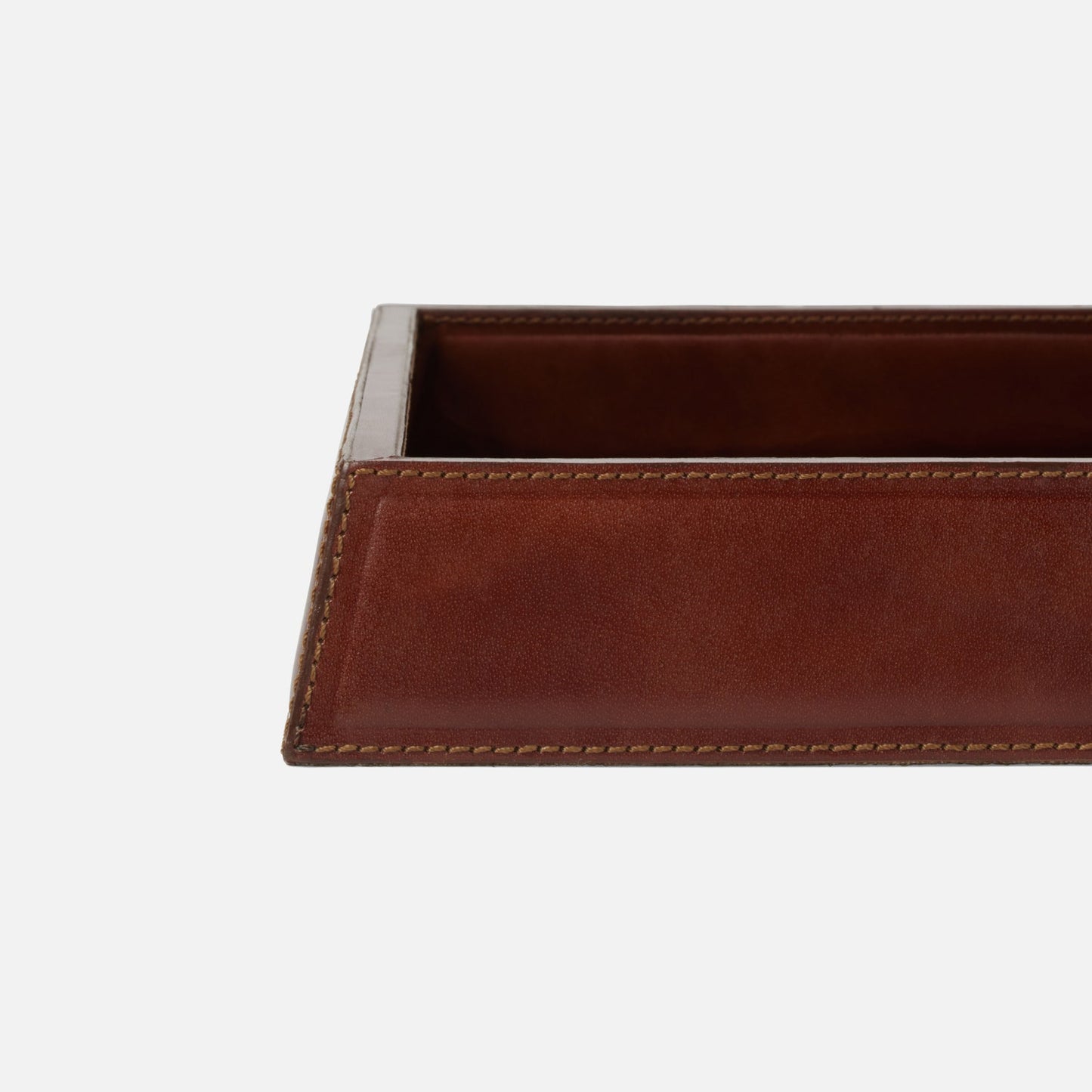 Brown leather tray with silver rim on a white background