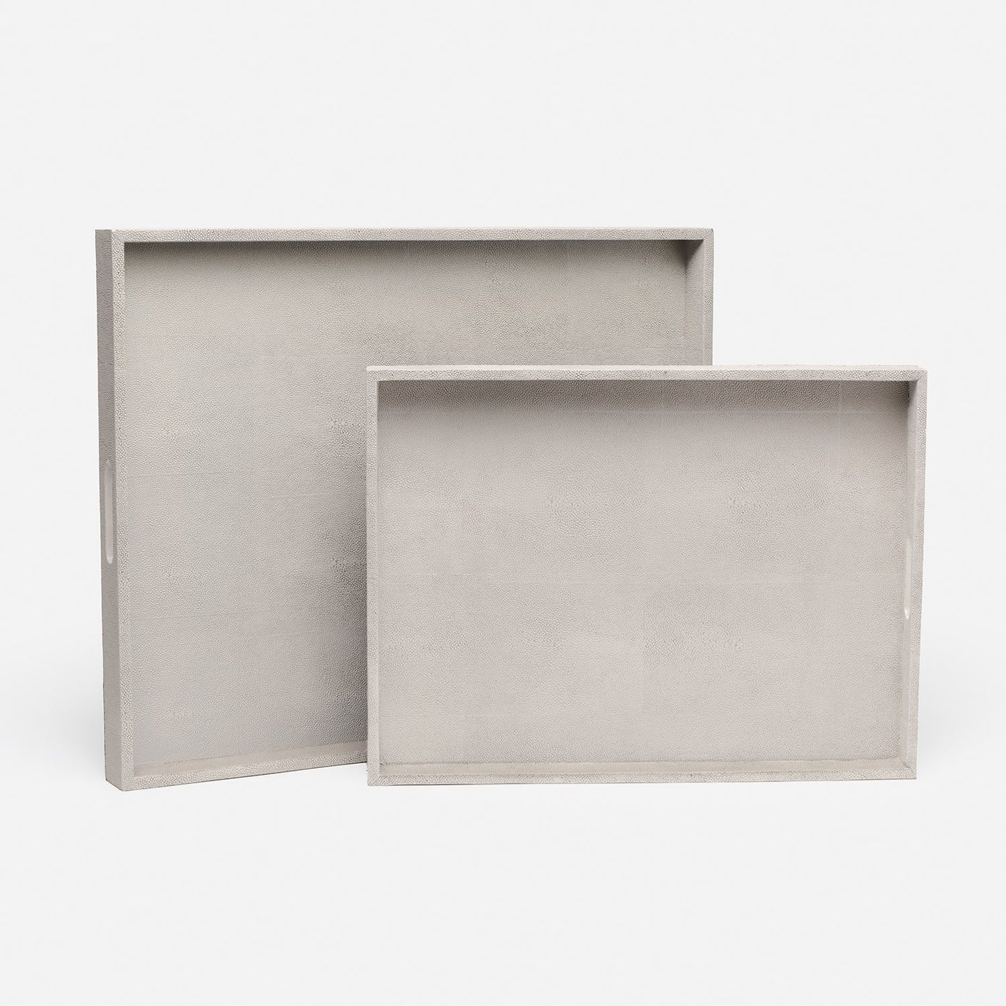 Two light gray trays on a white background
