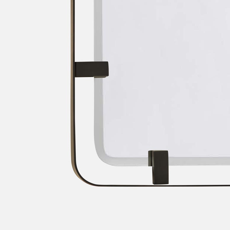 Modern black-framed mirror with a minimal design on a white background