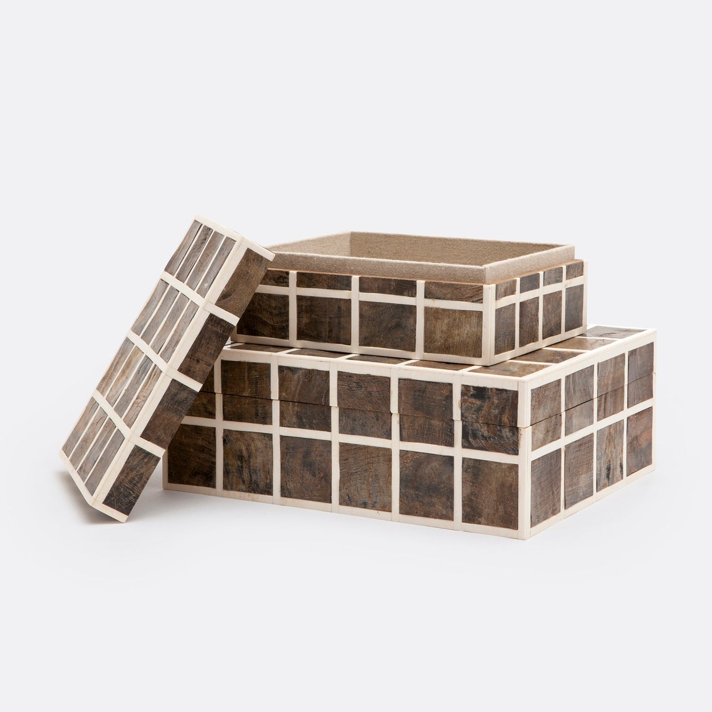 Wooden storage boxes with grid patterns on a white background