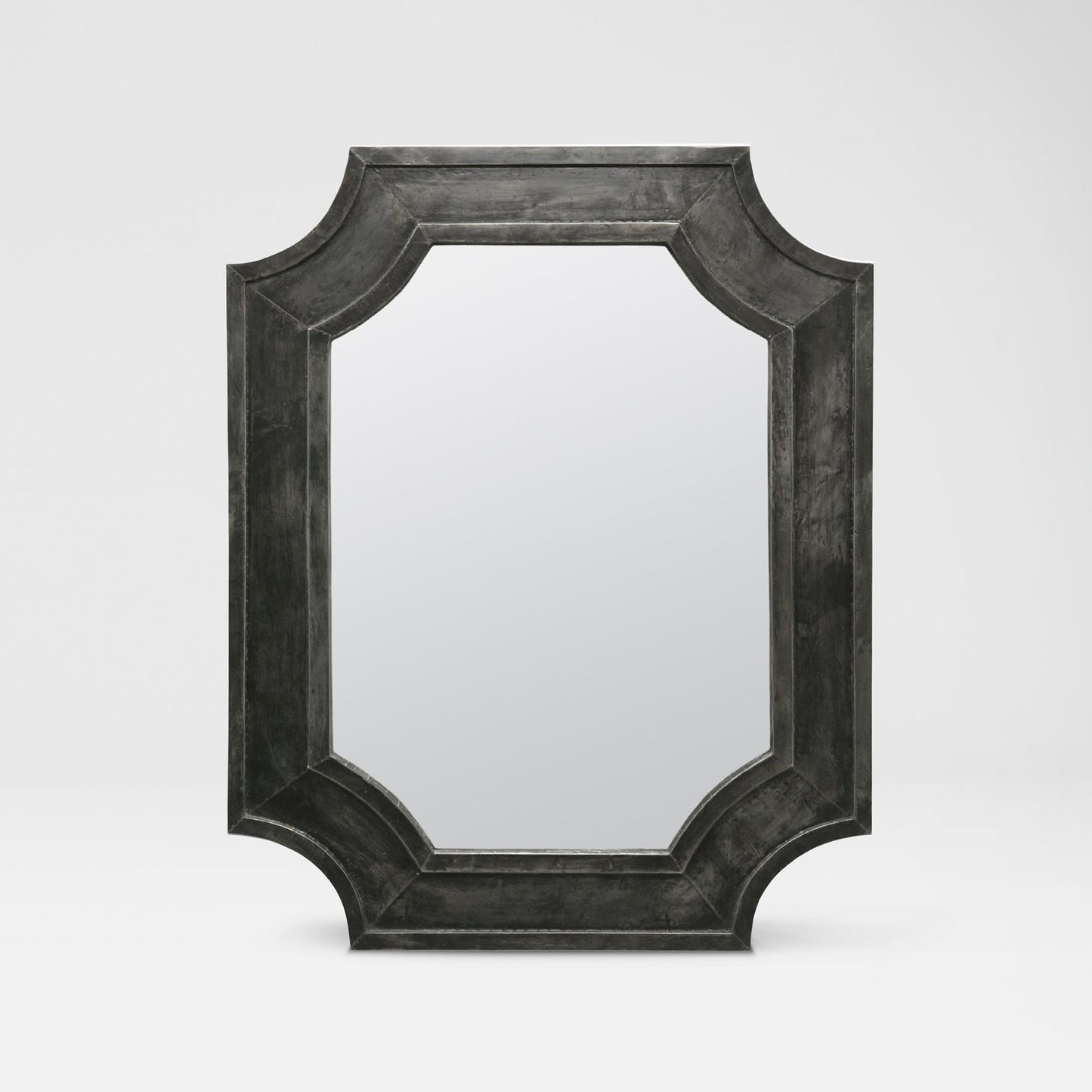 Rectangular mirror with a dark, textured frame on a light gray background