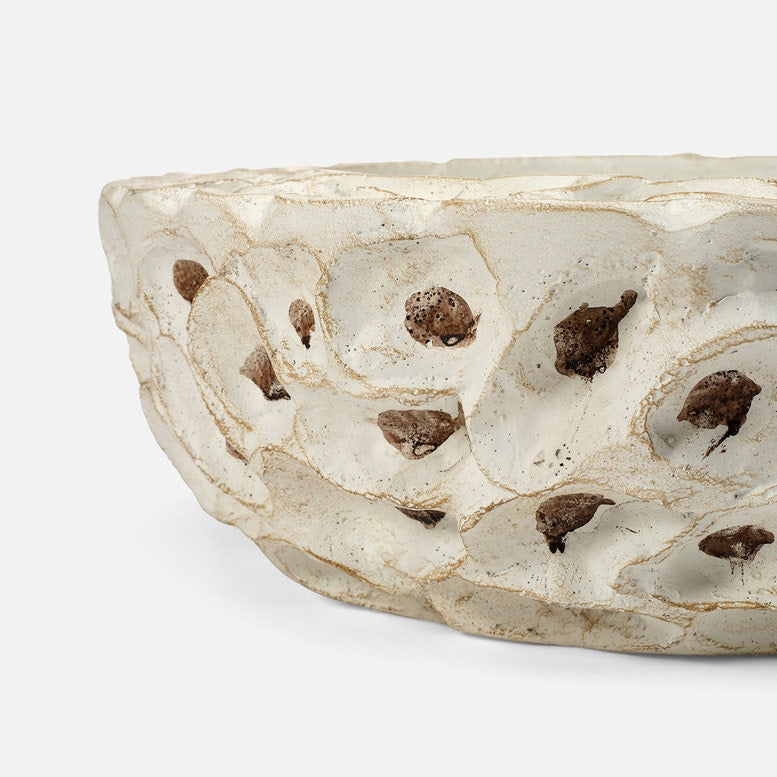 Decorative stone with embedded natural stones on a white background
