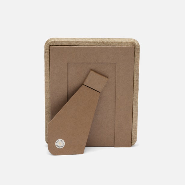 Brown cardboard box with a tie inside on a white background