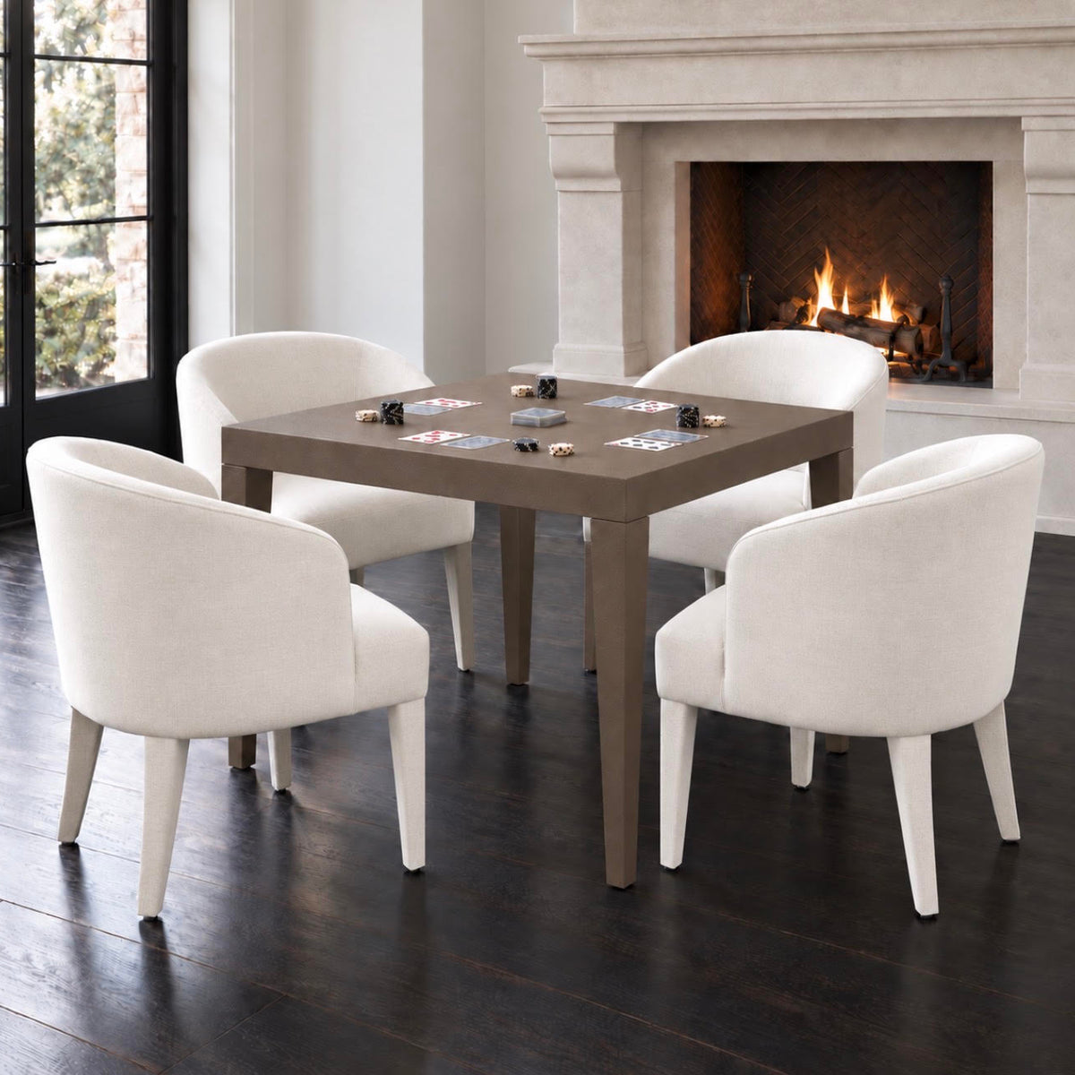 game table in the center of white rounded armchairs