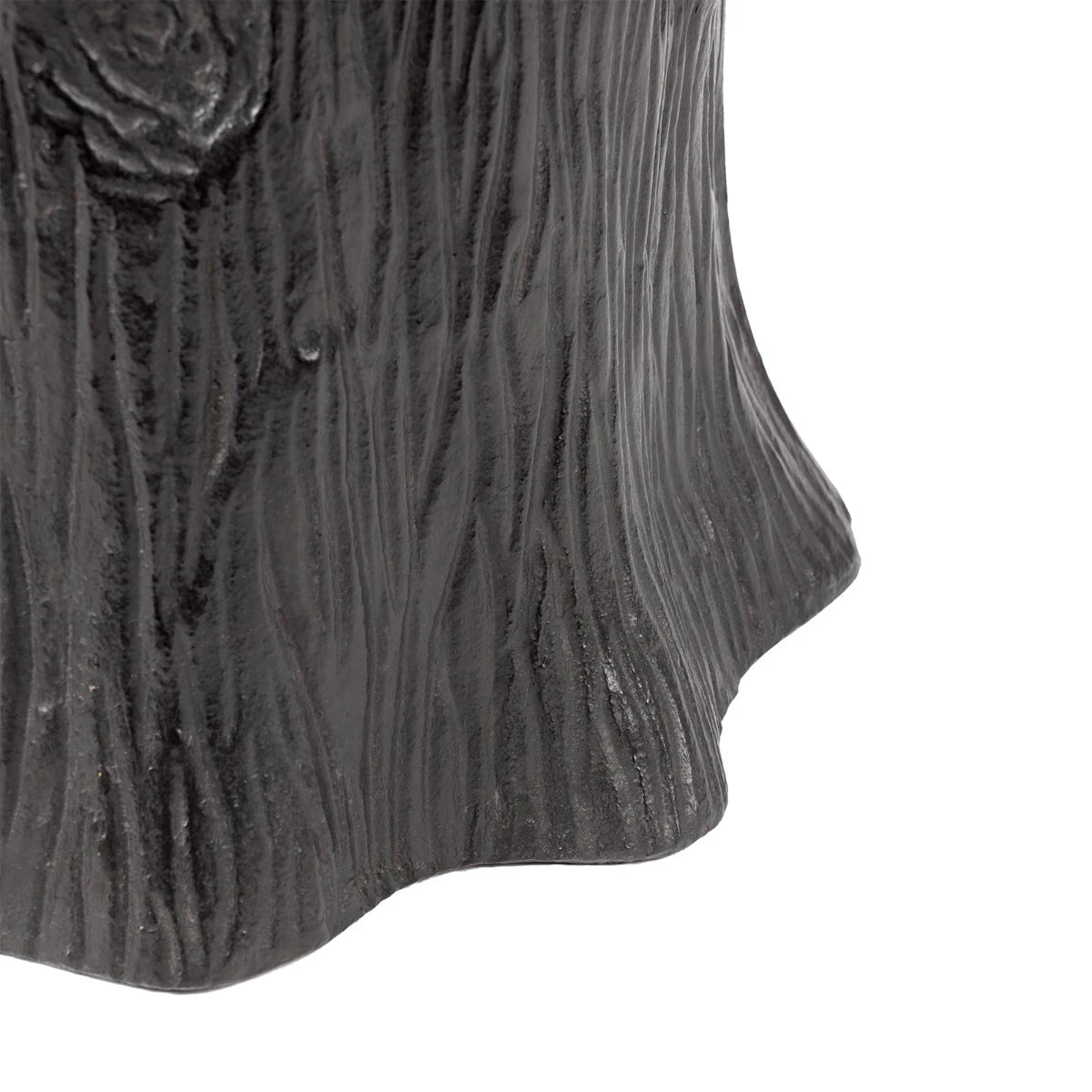 Close-up of a textured black object on a white background