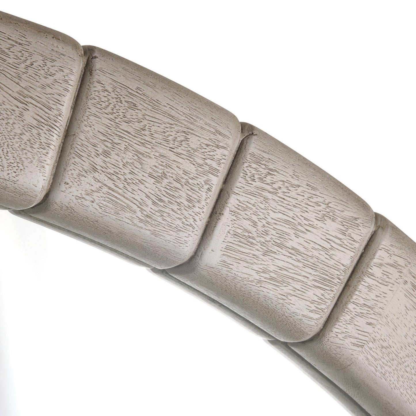 Close-up of a metallic cylindrical object with ribbed texture on a white background