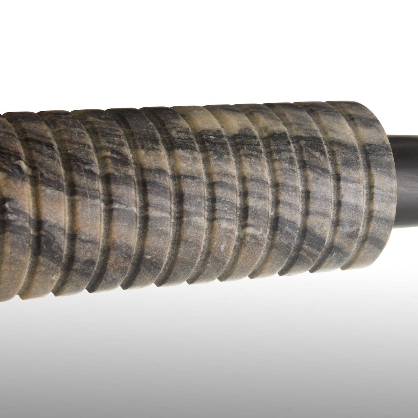 Close-up of a textured gun stock on a gray background