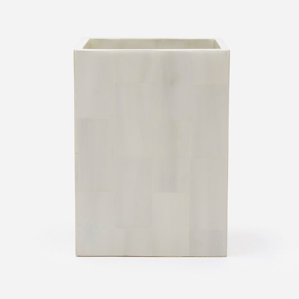 A faux horn white wastebasket, shown against a plain white background.