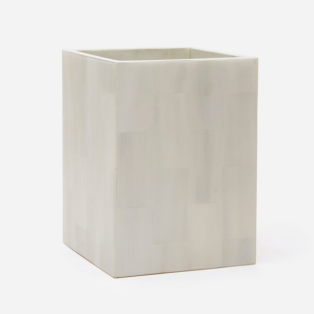 A faux horn white wastebasket, shown against a plain white background.