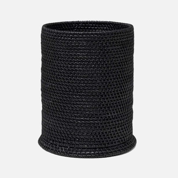 A black woven basket with a cylindrical shape and a textured, braided pattern, shown against a plain light gray background.