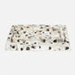 A rectangular resin tray with a raised textured border, featuring a translucent white base with black and beige organic inclusions, photographed on a seamless white background.