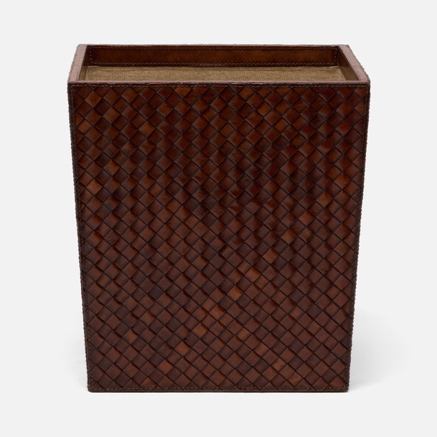 A rectangular woven leather storage bin or basket with a dark brown textured pattern, shown on a light gray background.