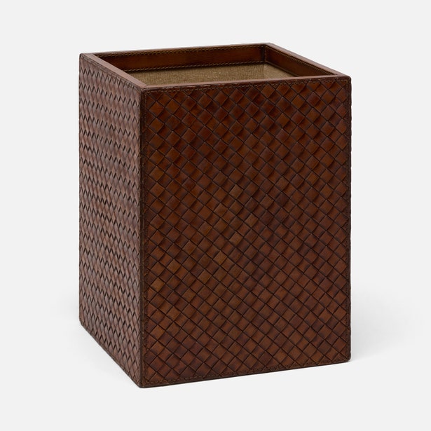 A rectangular brown woven leather organizer or desk mat with a textured basketweave pattern, shown on a light gray background.