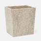 A square wastebasket made from light beige marble with natural veining, shown on a plain light gray background.