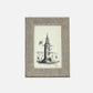 Framed artwork of a lighthouse on a white background