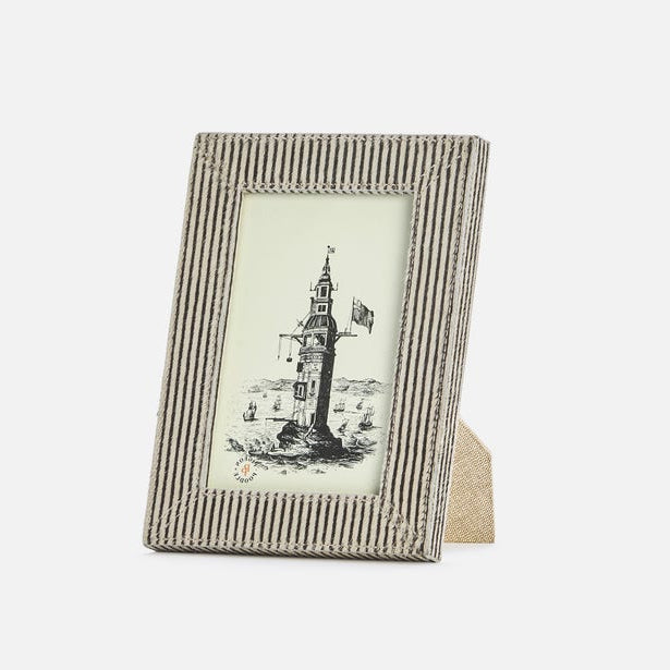 Striped photo frame with a printed image of a clock tower on a white background