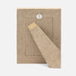 Beige fabric bookmark with a button on a matching fabric background