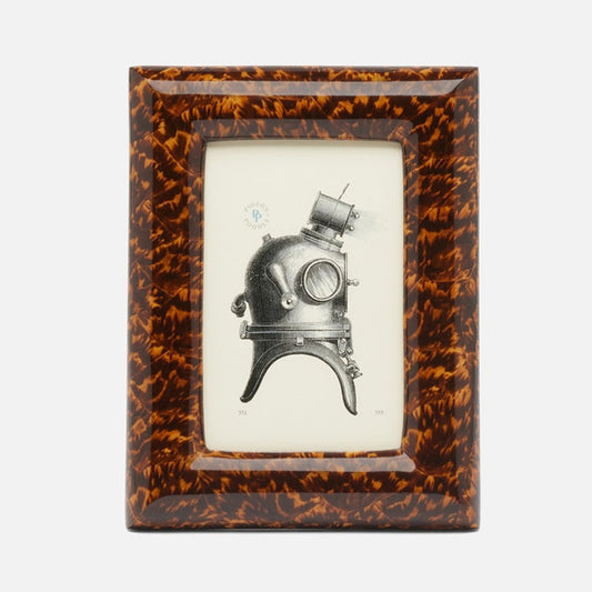 Framed illustration of a vintage diving helmet on a white background