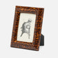 Tortoiseshell frame with a black and white illustration on a white background