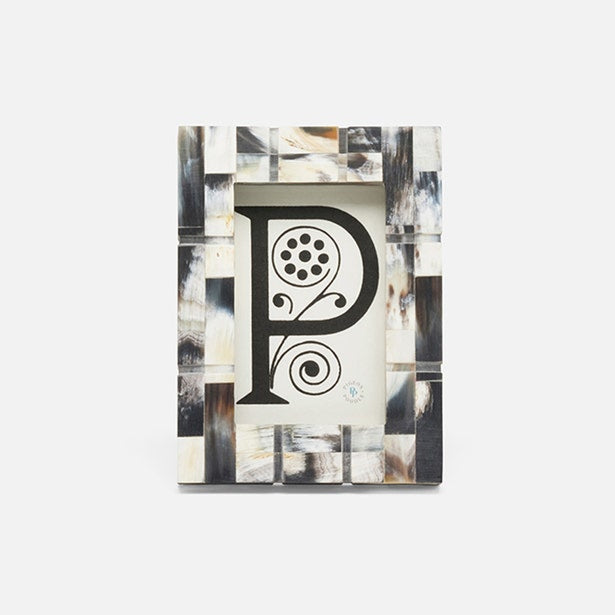 Decorative book with a stylized letter 'P' on a white background