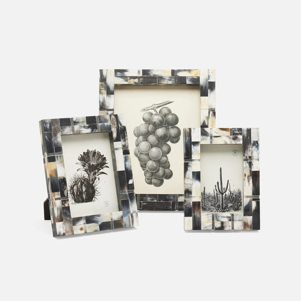 Set of three decorative picture frames with botanical illustrations on a white background