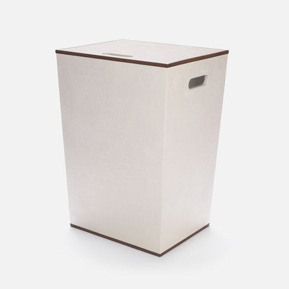 Beige laundry basket with brown rim on a white background