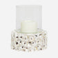 Candle holder with a candle inside on a white background