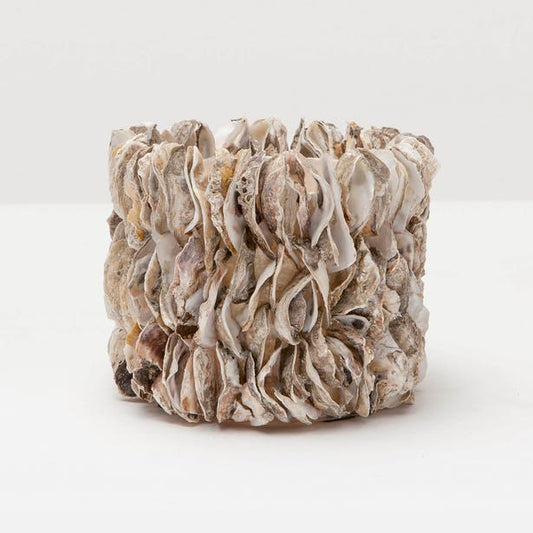 Textured ceramic candle holder on a white background