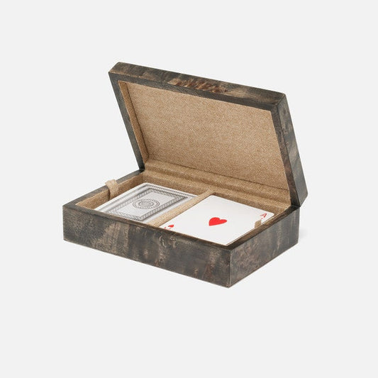 Wooden box with playing cards on a white background