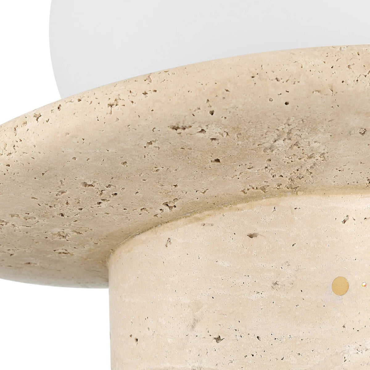 Close-up of a textured stone-like surface with a white base.