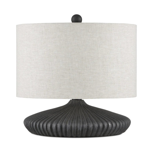 Table lamp with a ribbed black base and white lampshade on a white background