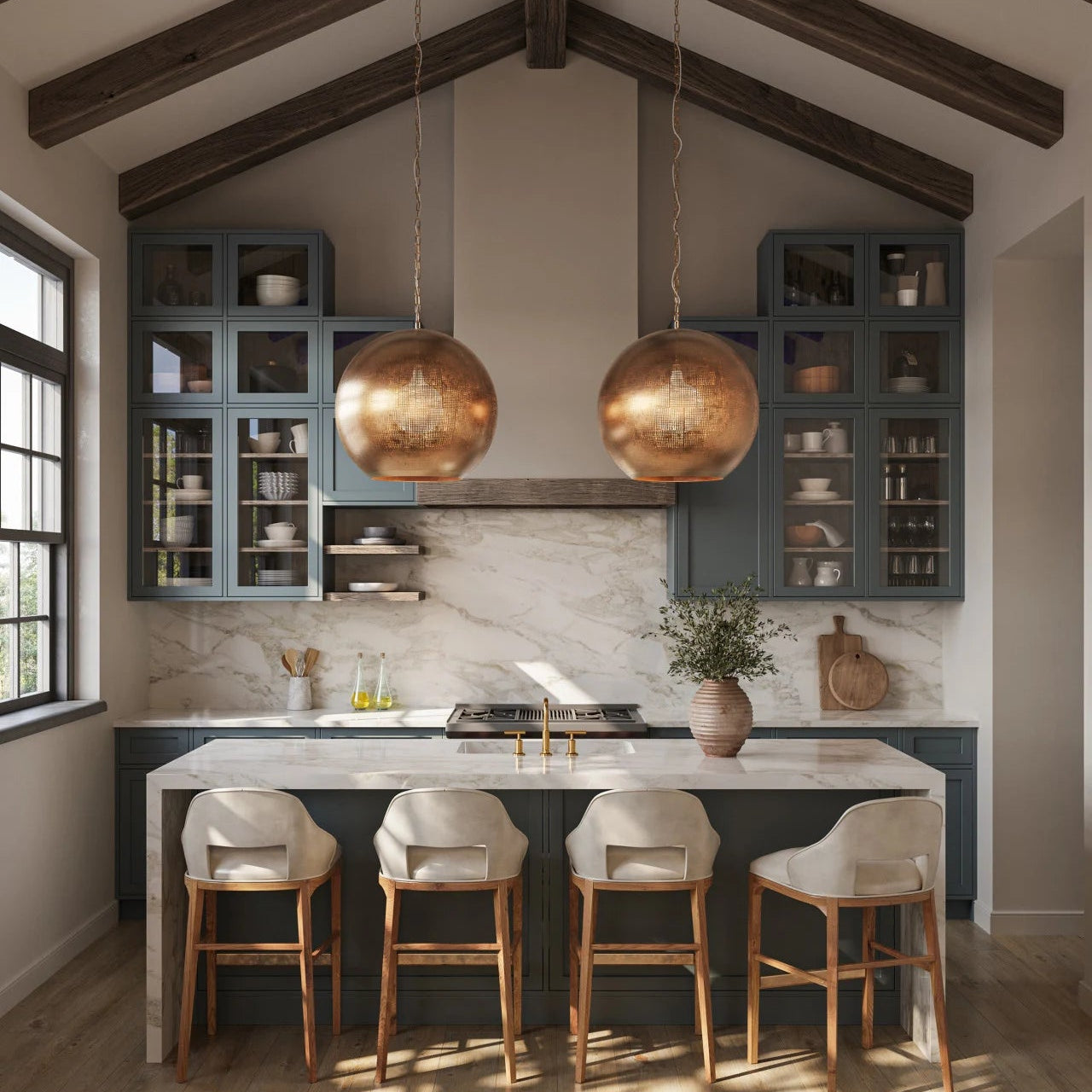 Modern kitchen with pendant lights, bar stools, and a marble countertop.