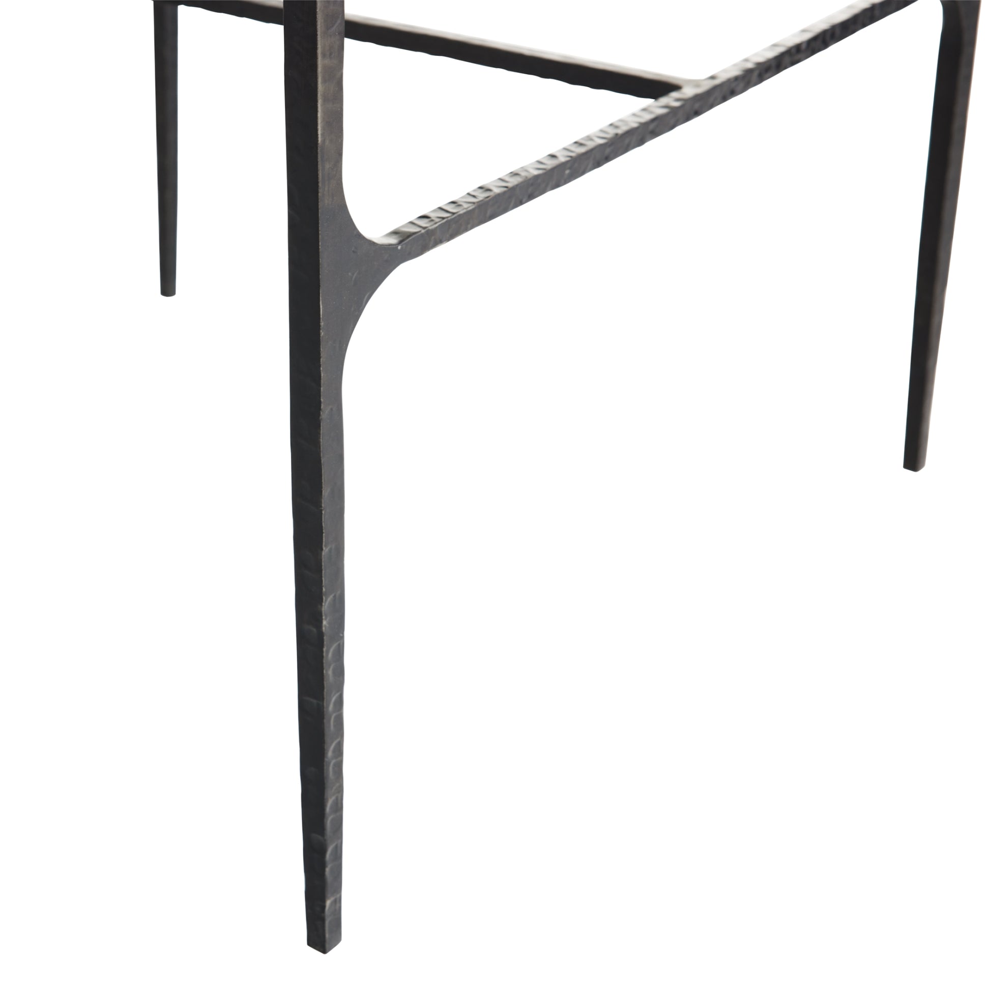Close-up of a black metal chair leg on a white background