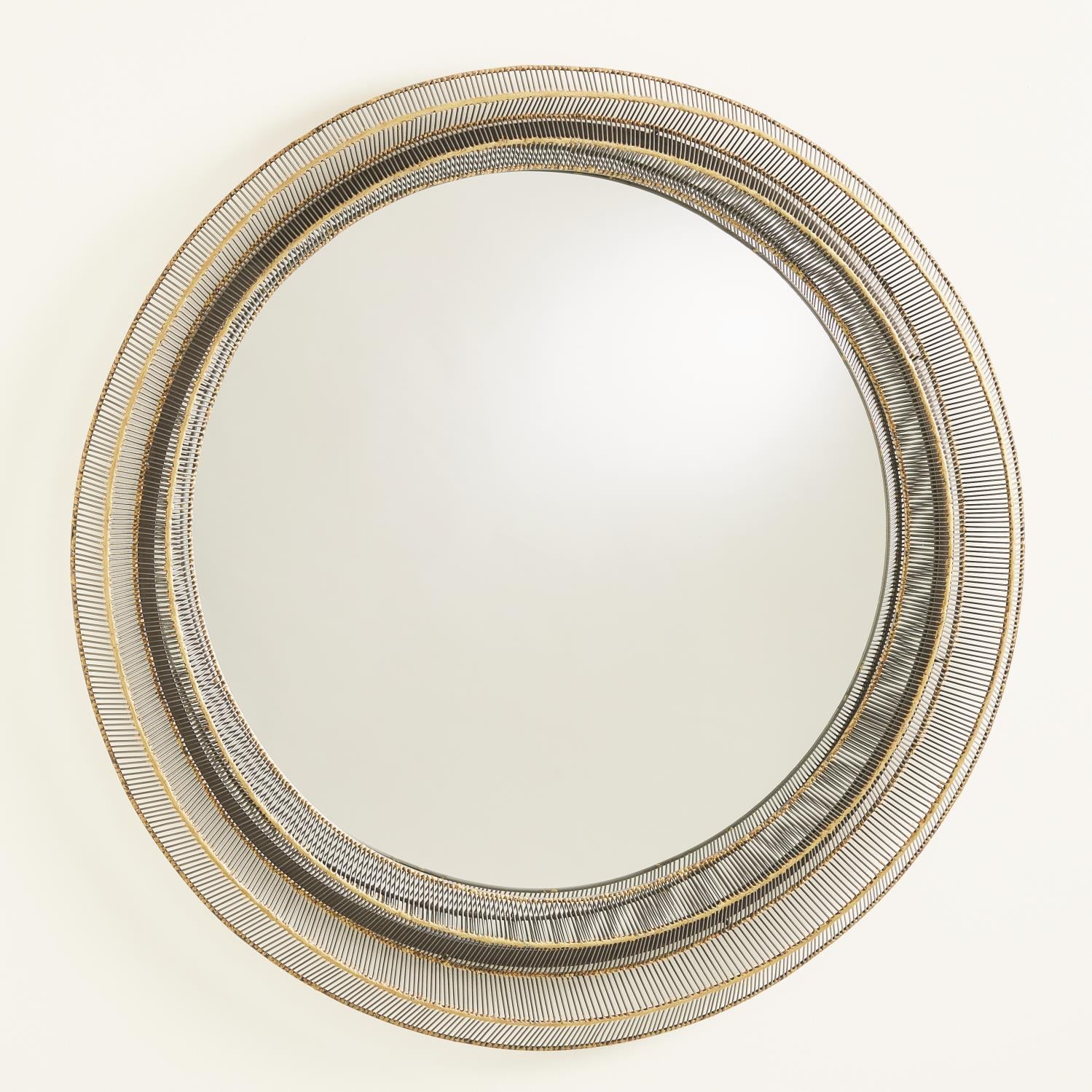 Round mirror with a gold frame on a white background