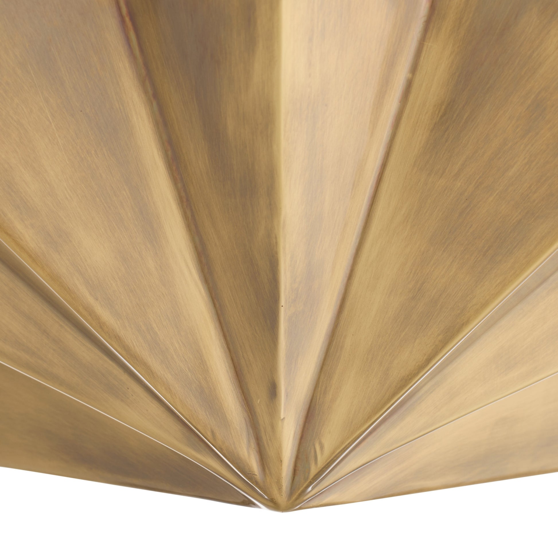 Close-up of a gold metallic surface with a textured pattern