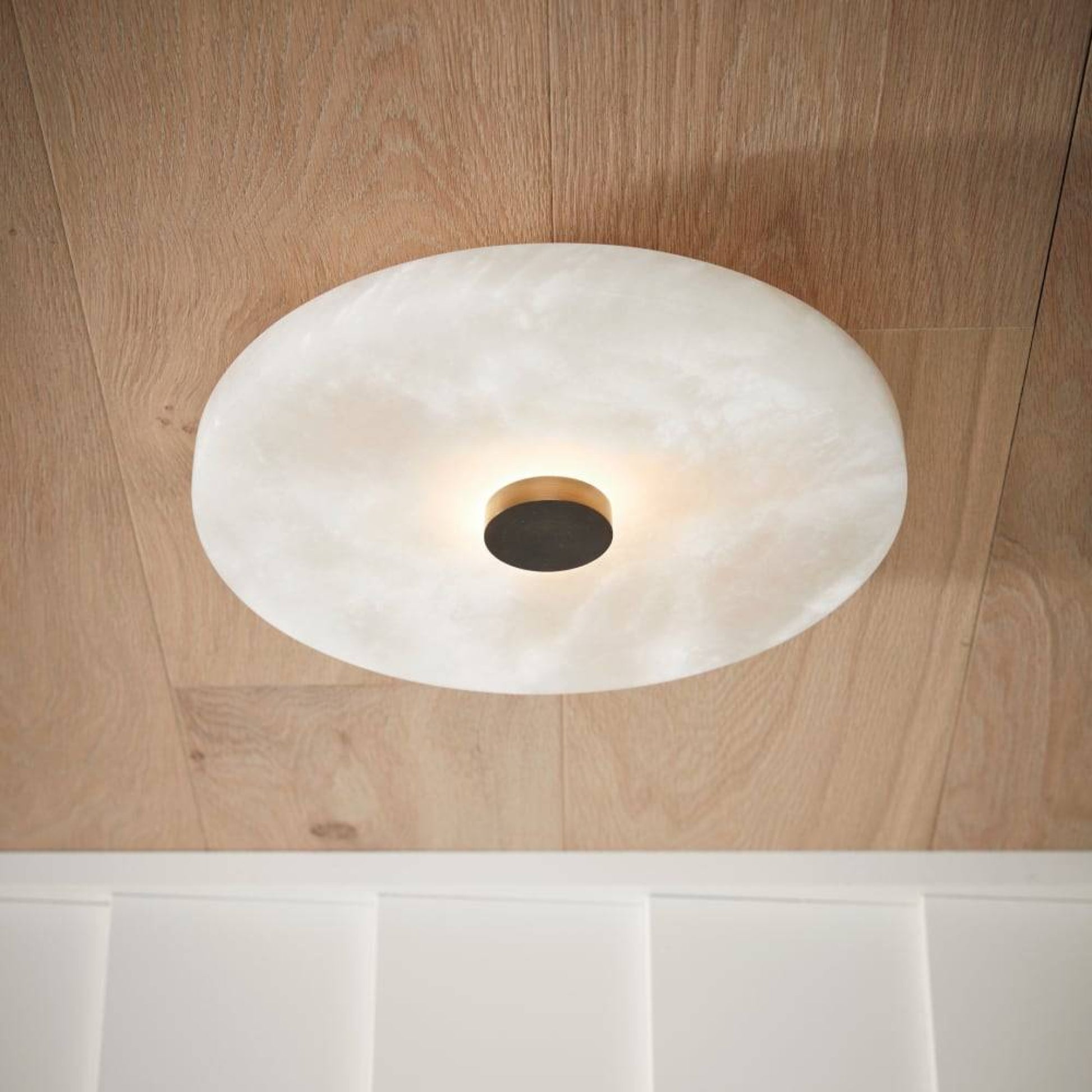 Ceiling light fixture on a wooden ceiling