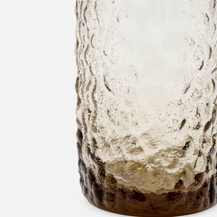 Textured ceramic vase on a white background