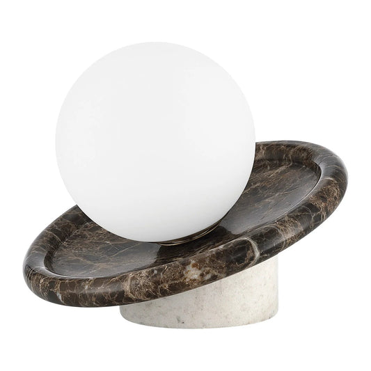 Decorative object with a white sphere on a marble base