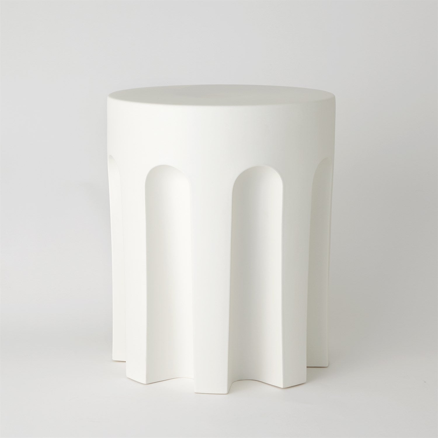 White ceramic side table with arches on a white background