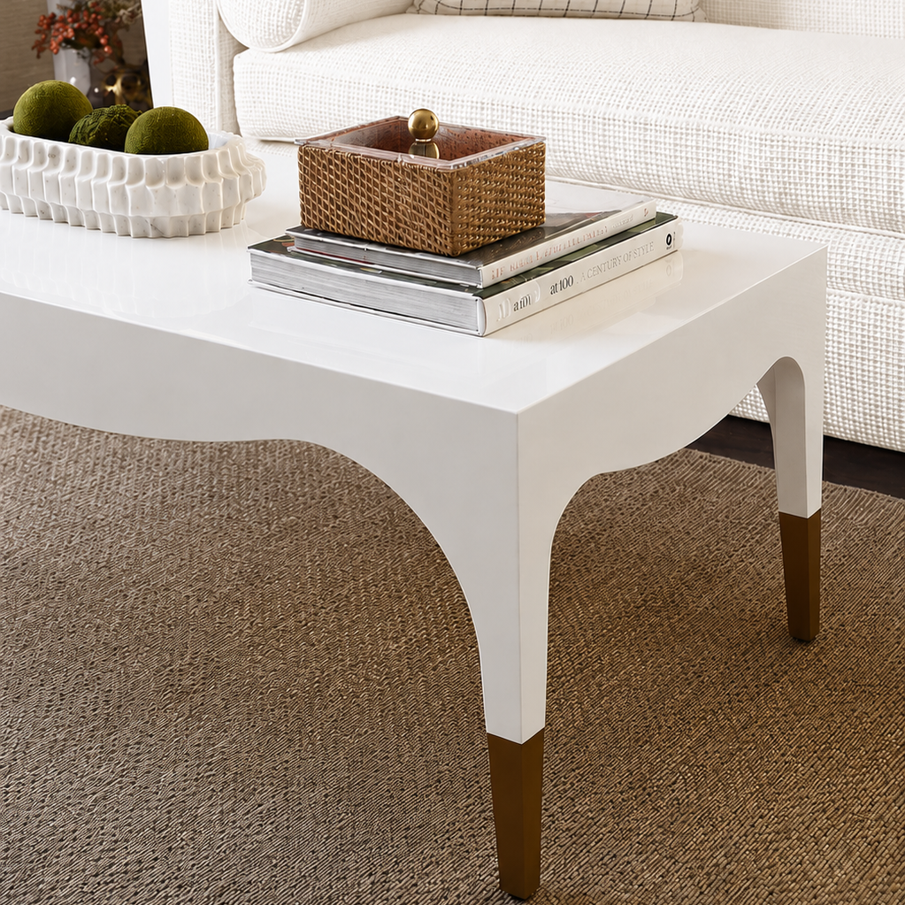 White coffee table with decorative items in a living room setting