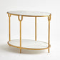 Decorative side table with gold frame and white marble top on a white background