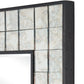 Decorative mirror with a black frame and glass panels on a white background